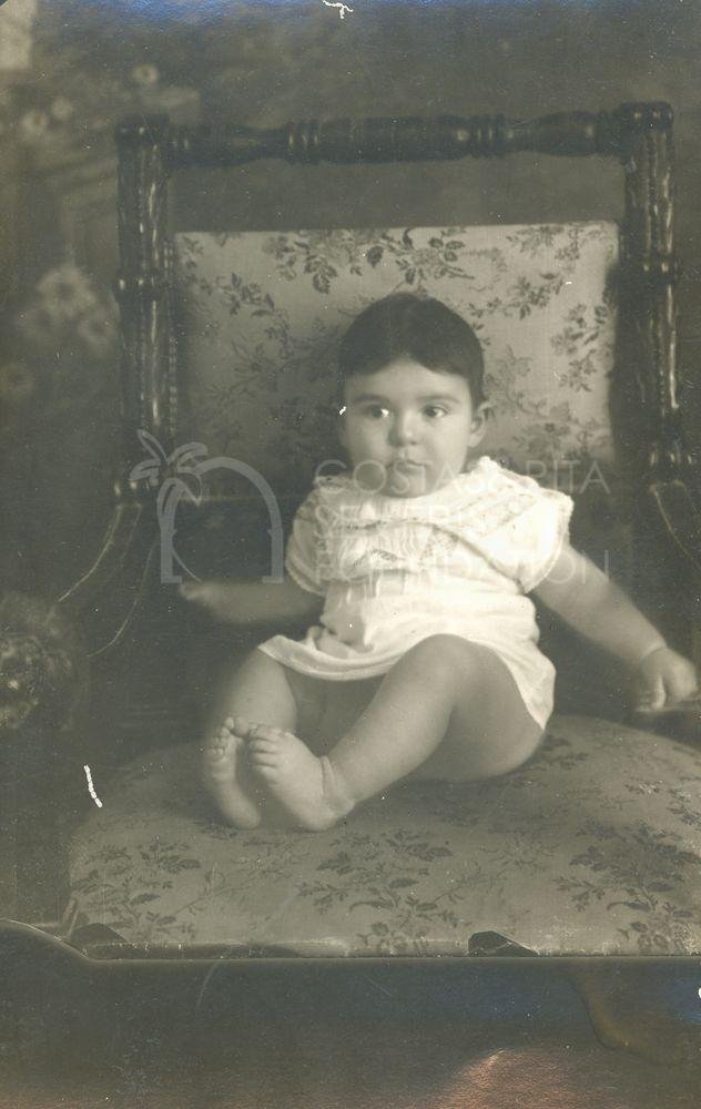 Baby Emilia sitting in a chair-pht_GM_035