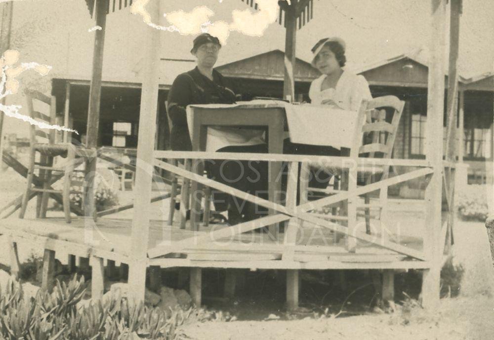 Two people sitting in a gazebo-pht_GM_096