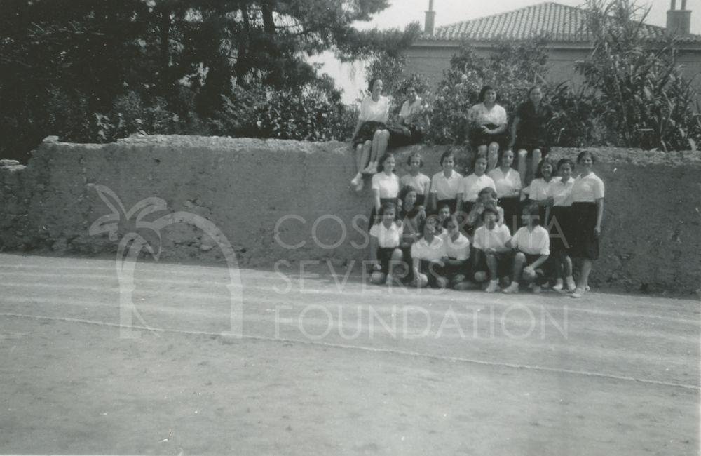 Group photograph of school girls near a wall-pht_GM_118