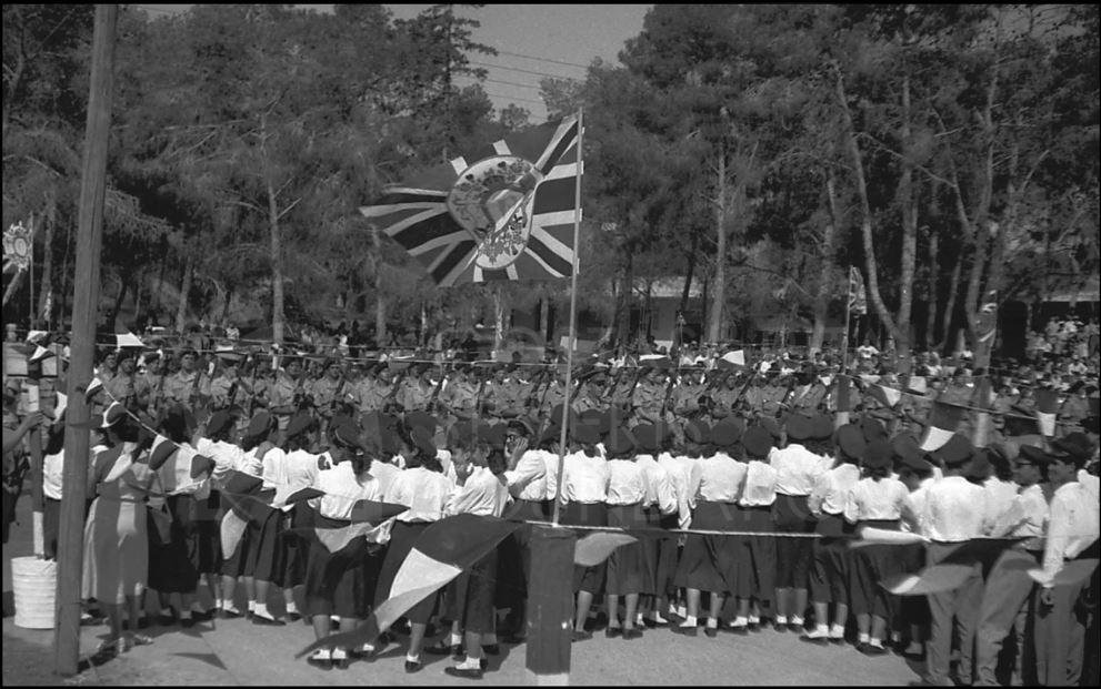 The school girls watch the parade and put their hands over their ears when the 21 gun salute goes off-pht_RC_088